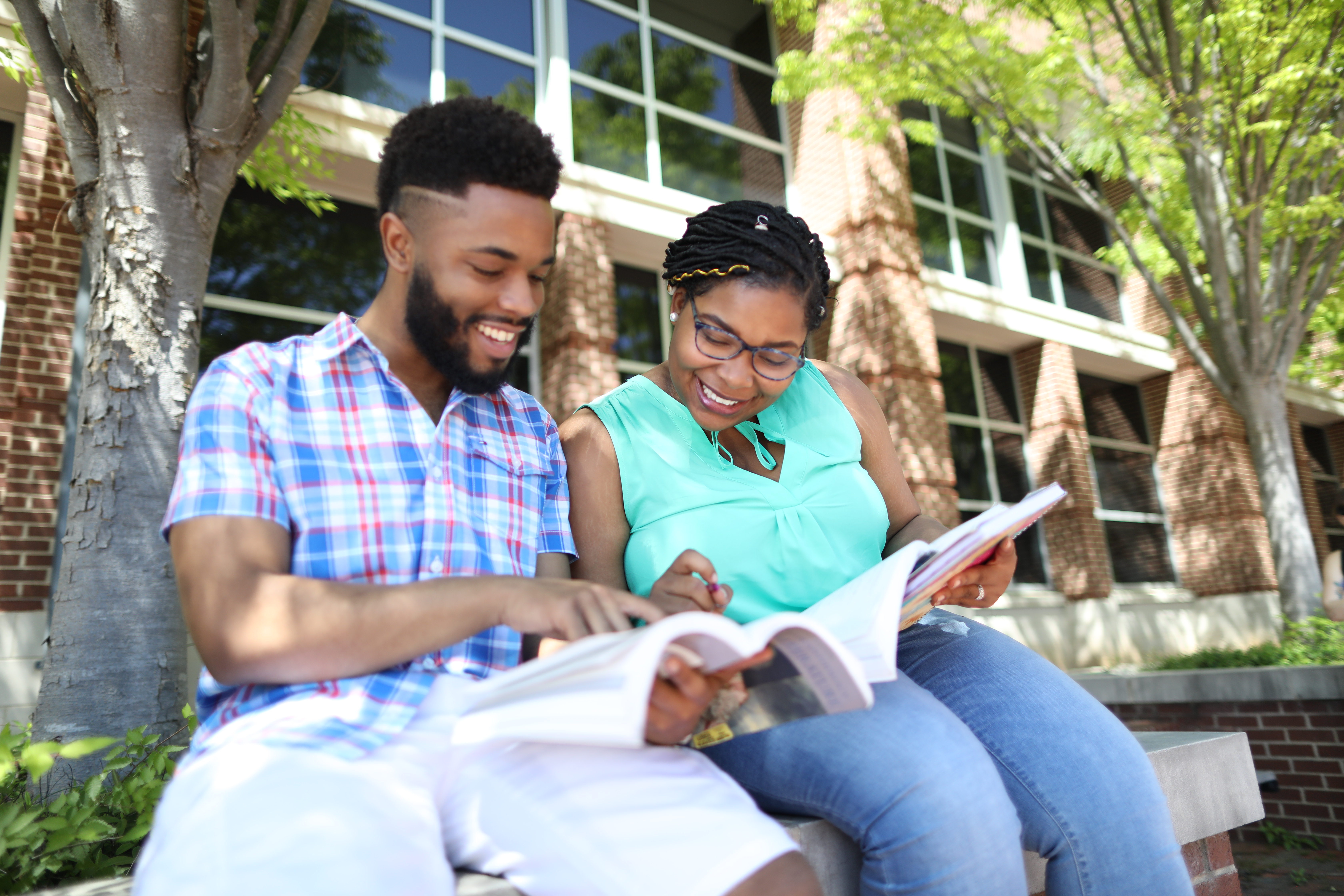 two nc a&T students studying outside