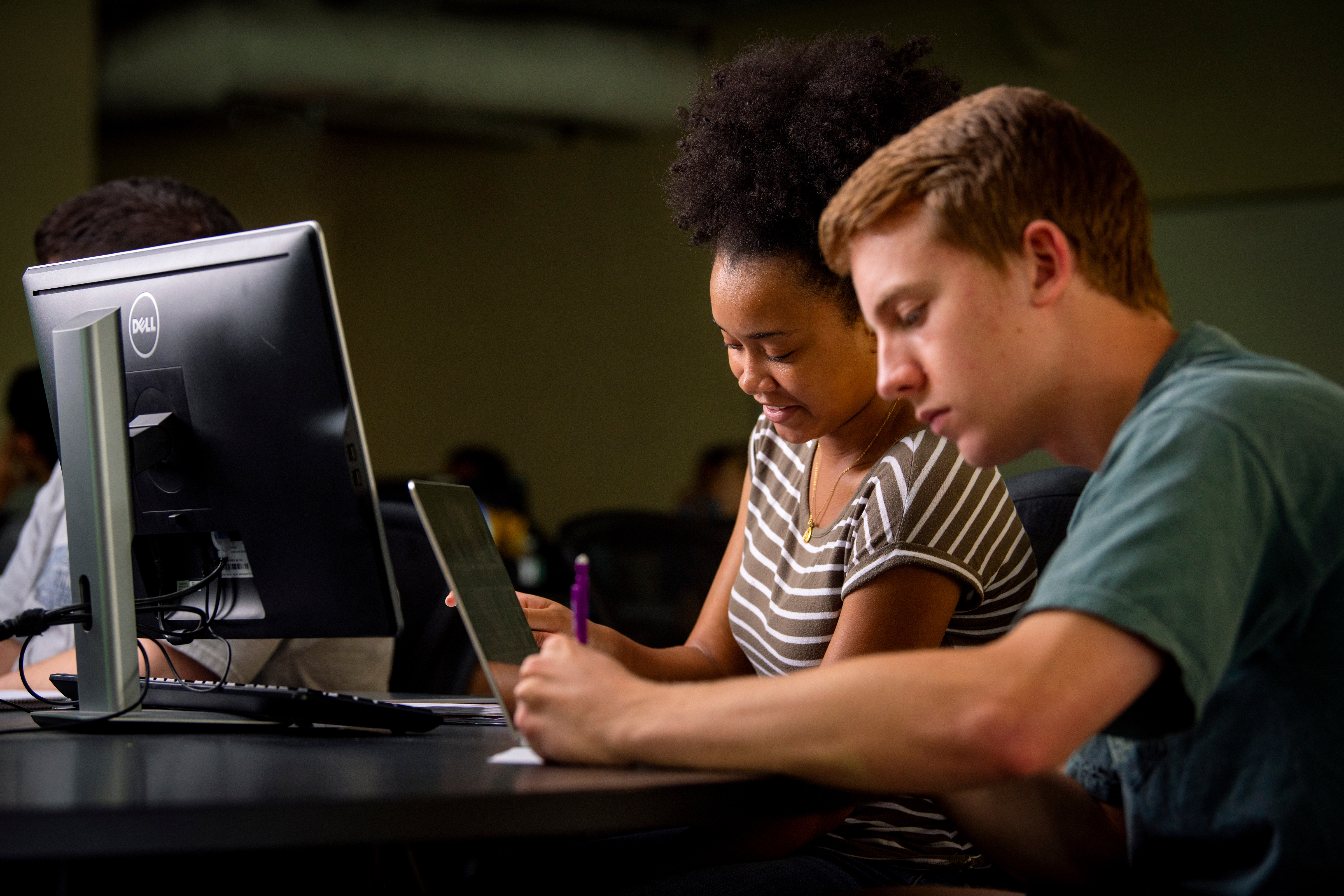 Students looking at a computer 