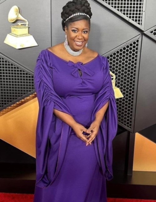 NaTasha Williams posing in a purple evening gown.