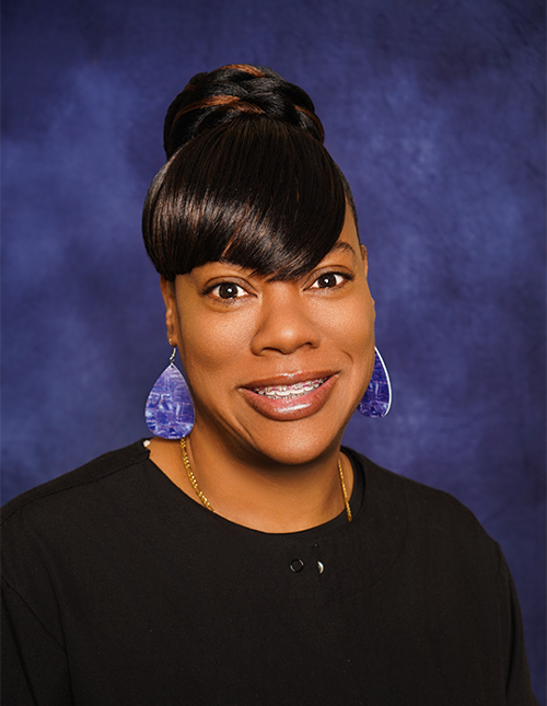 Ms. Woods professional photo in scrubs