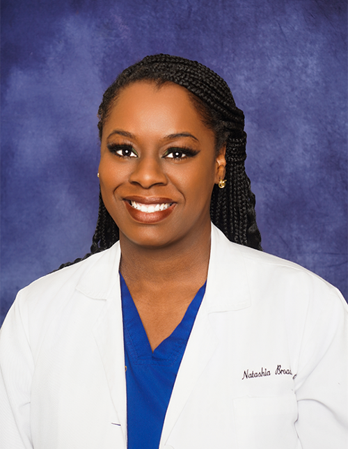Natashia Broadnax in a professional photo in a lab coat