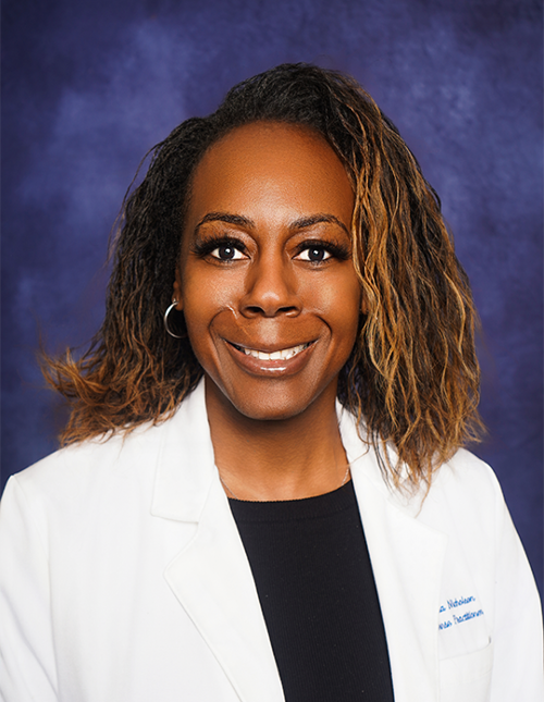 Dr. Yolanda Nicholson in a professional photo in a lab coat