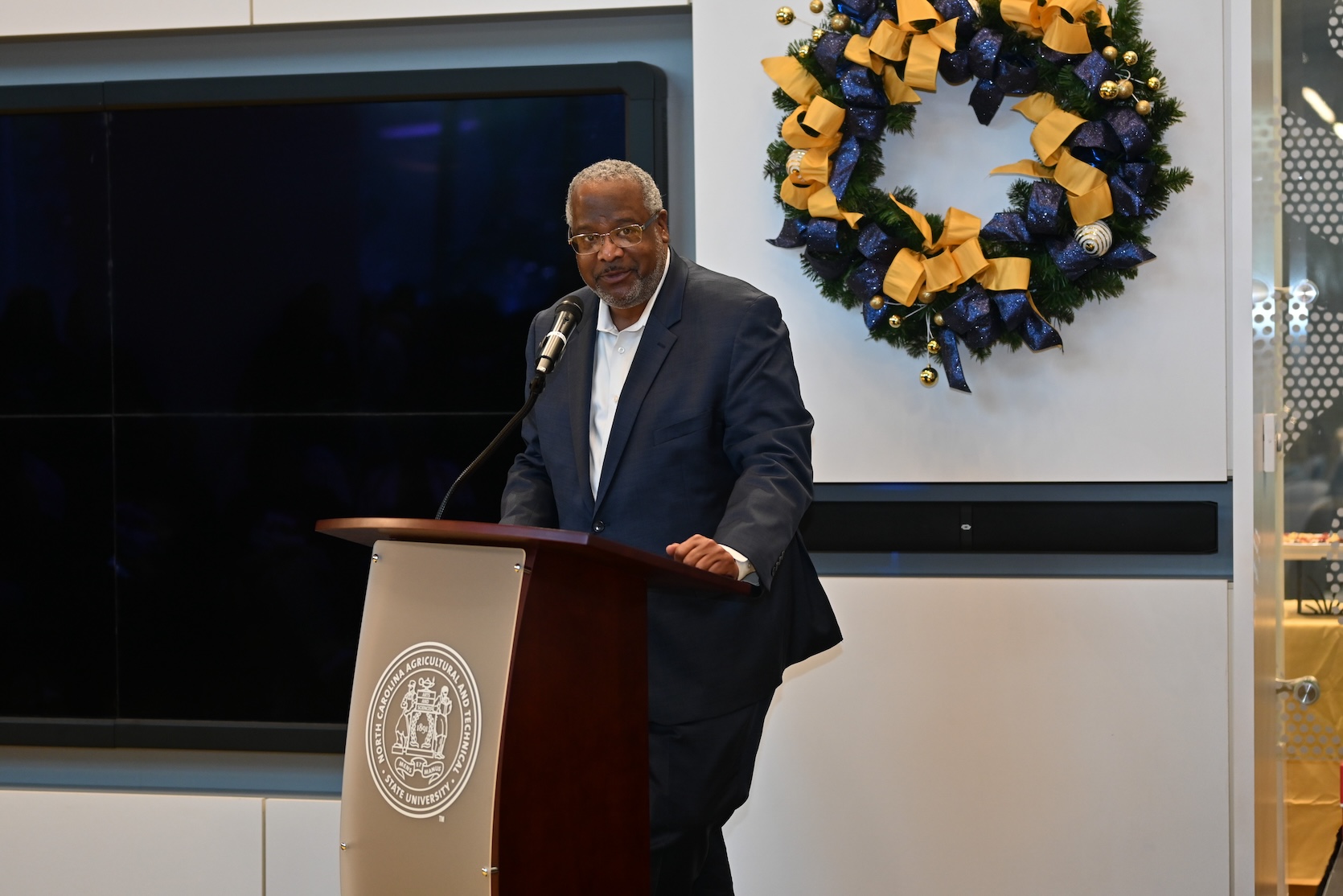 Dean of Students speaking at Holiday Tree Lighting