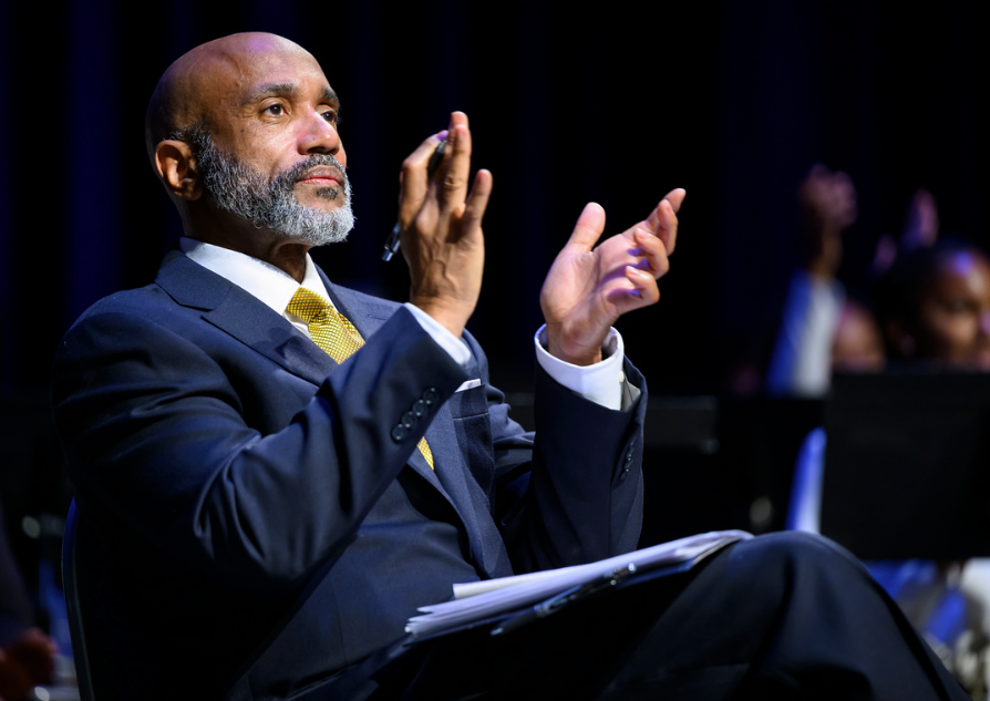 Chancellor James R. Martin applauds a speaker at the Fall 2024 Convocation.