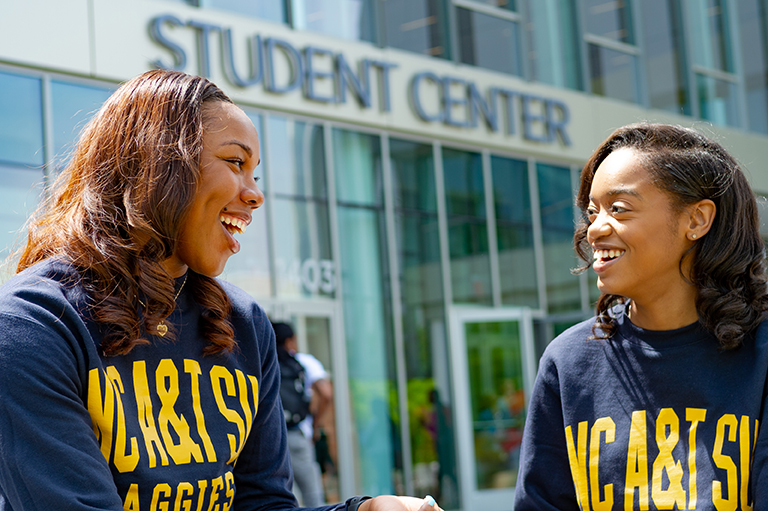 Two A&T students talk outside