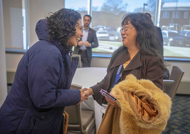 U.S. Department of Agriculture Deputy Secretary Xochitl Torres Small congratulates Chyi Lyi “Kathleen” Liang, Ph.D., who is the recipient of a nearly $1 million grant to build an assessment tool to study long-term impacts of USDA programming in various communities.
