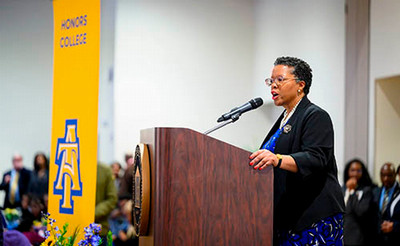 Honors College Dean Margaret I. Kanipes speaking at a podium