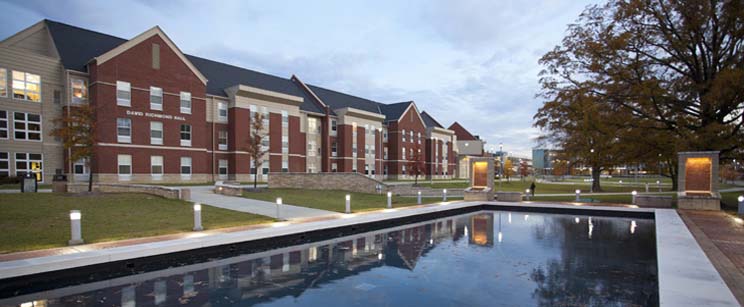 Photo of residence hall and reflection pond.